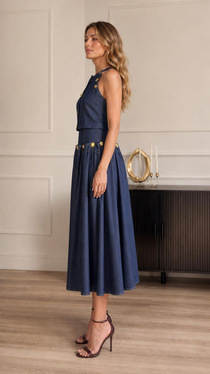 Side profile of model in blue denim two-piece outfit