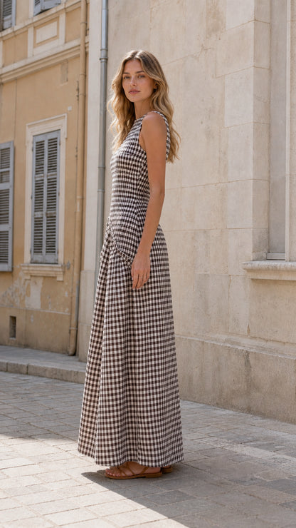 Model in brown gingham maxi dress, side profile