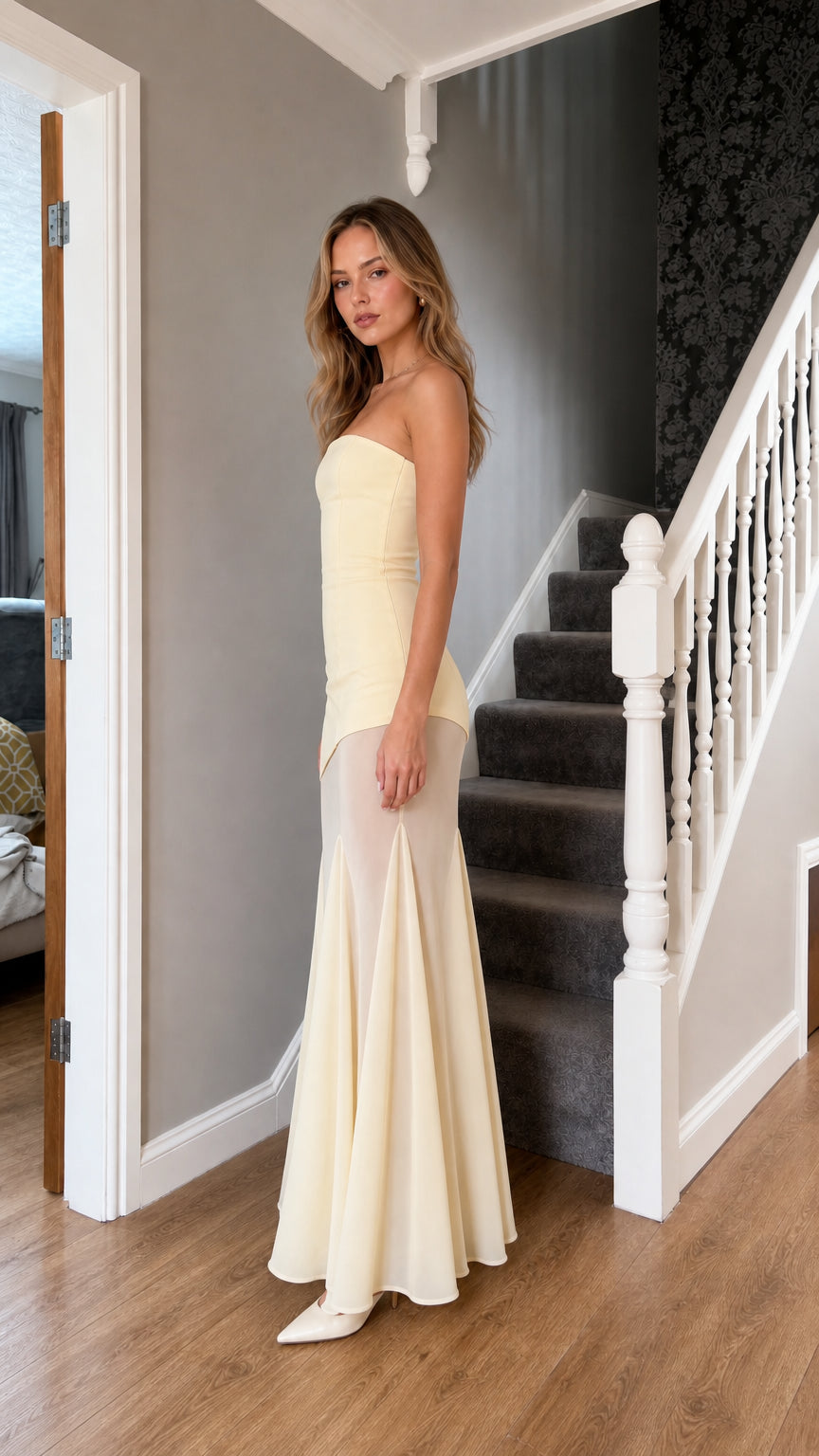 Side profile view of light yellow maxi dress
