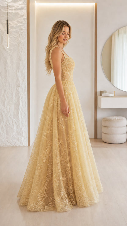 Side profile view of champagne formal ball gown