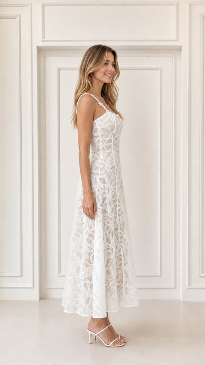 Side view of woman in elegant white lace A-line midi dress