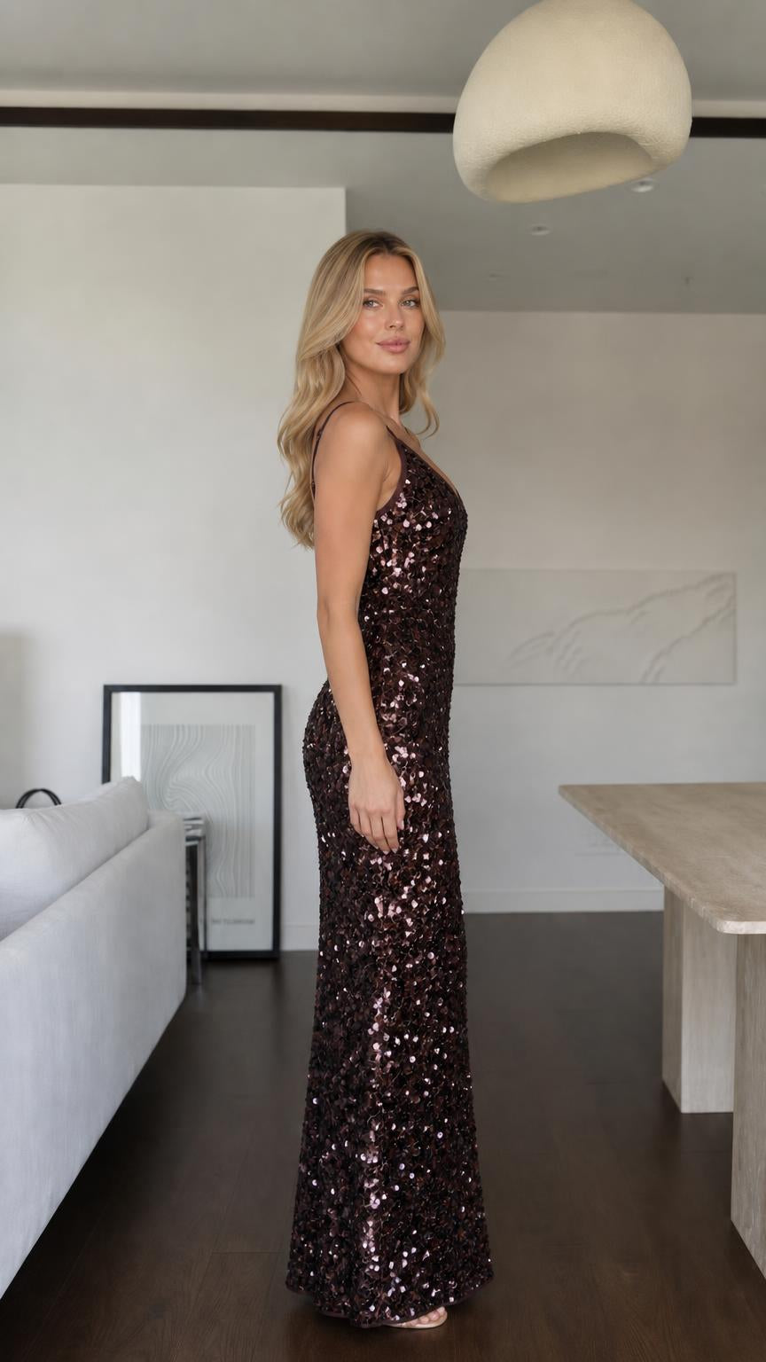 Side profile view of dark brown sequin maxi dress