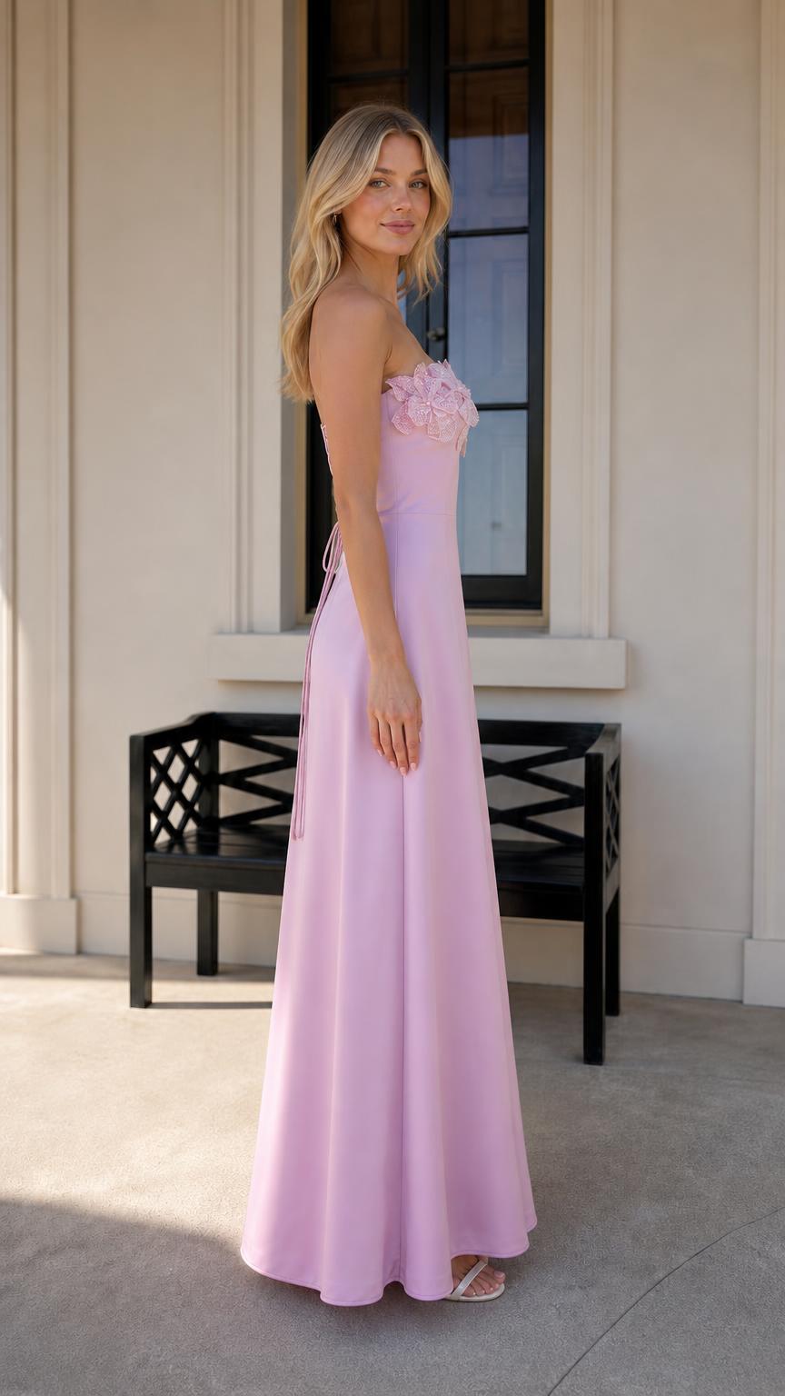 Side profile view of model in pink evening dress