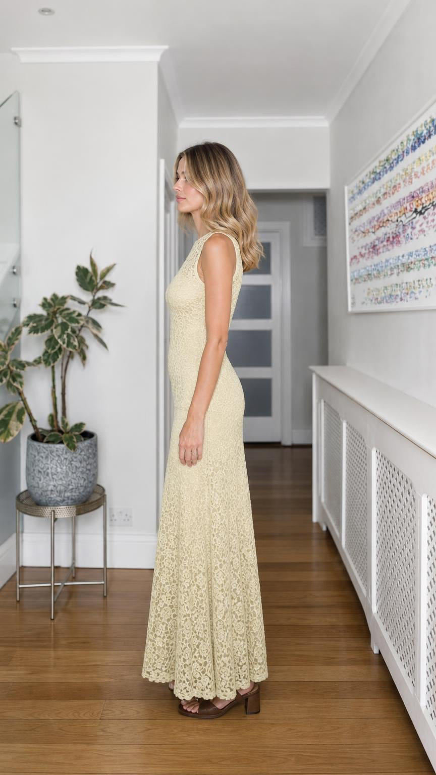 Side profile of yellow lace maxi dress