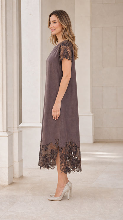 Side profile view of model in taupe midi dress showing slit hem detail