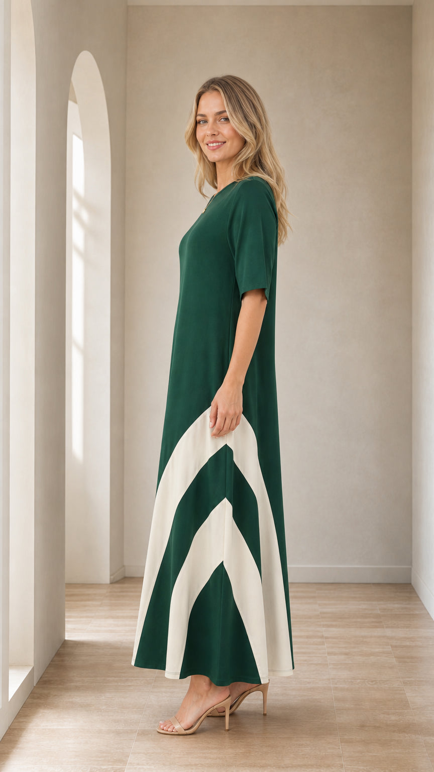 Side profile of woman in Forest Green maxi dress