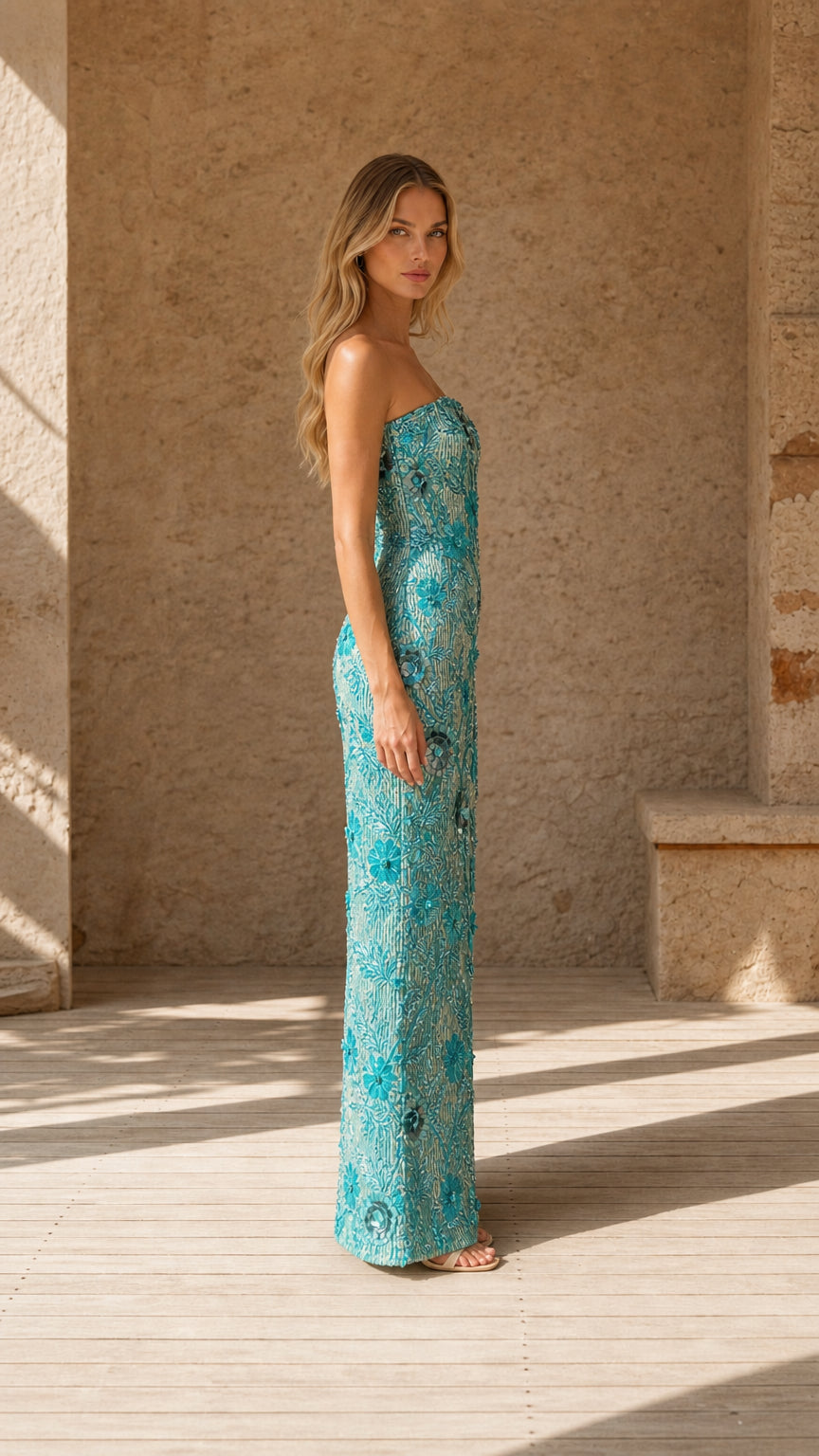 Side profile view of Aqua Blue embellished strapless formal evening dress
