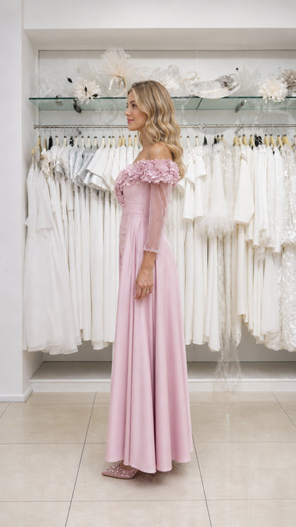 Model wearing pink evening gown, side view