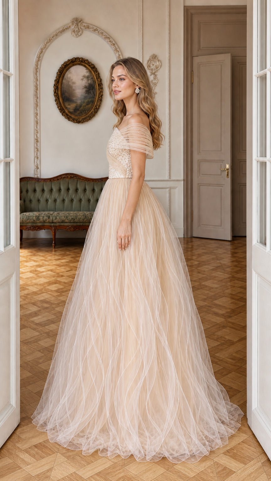 Side profile of champagne asymmetrical tulle evening ball gown
