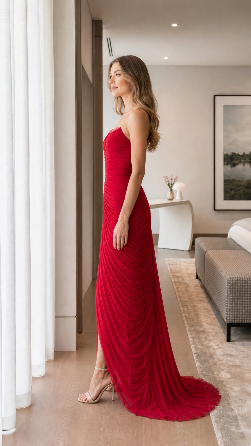 Side profile view of red evening maxi dress with court train