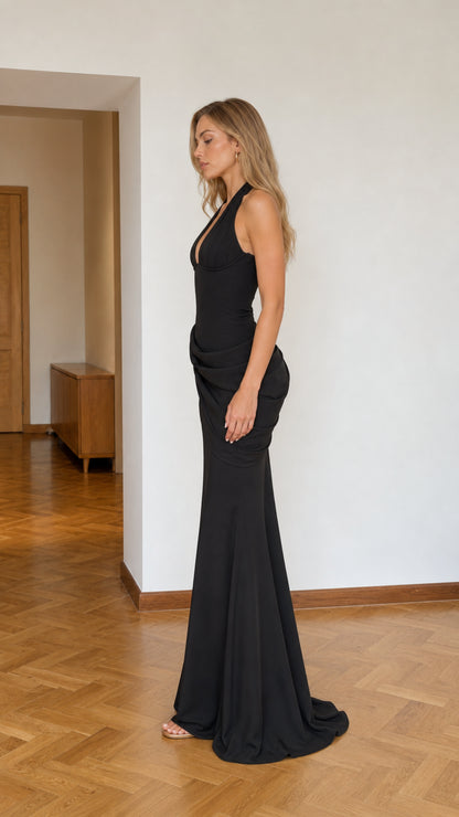 Side profile view of the black evening dress