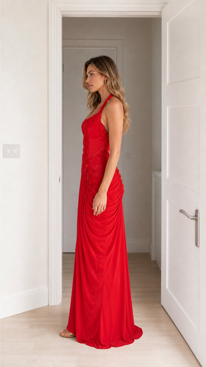 Side view of model in red halter neck maxi dress