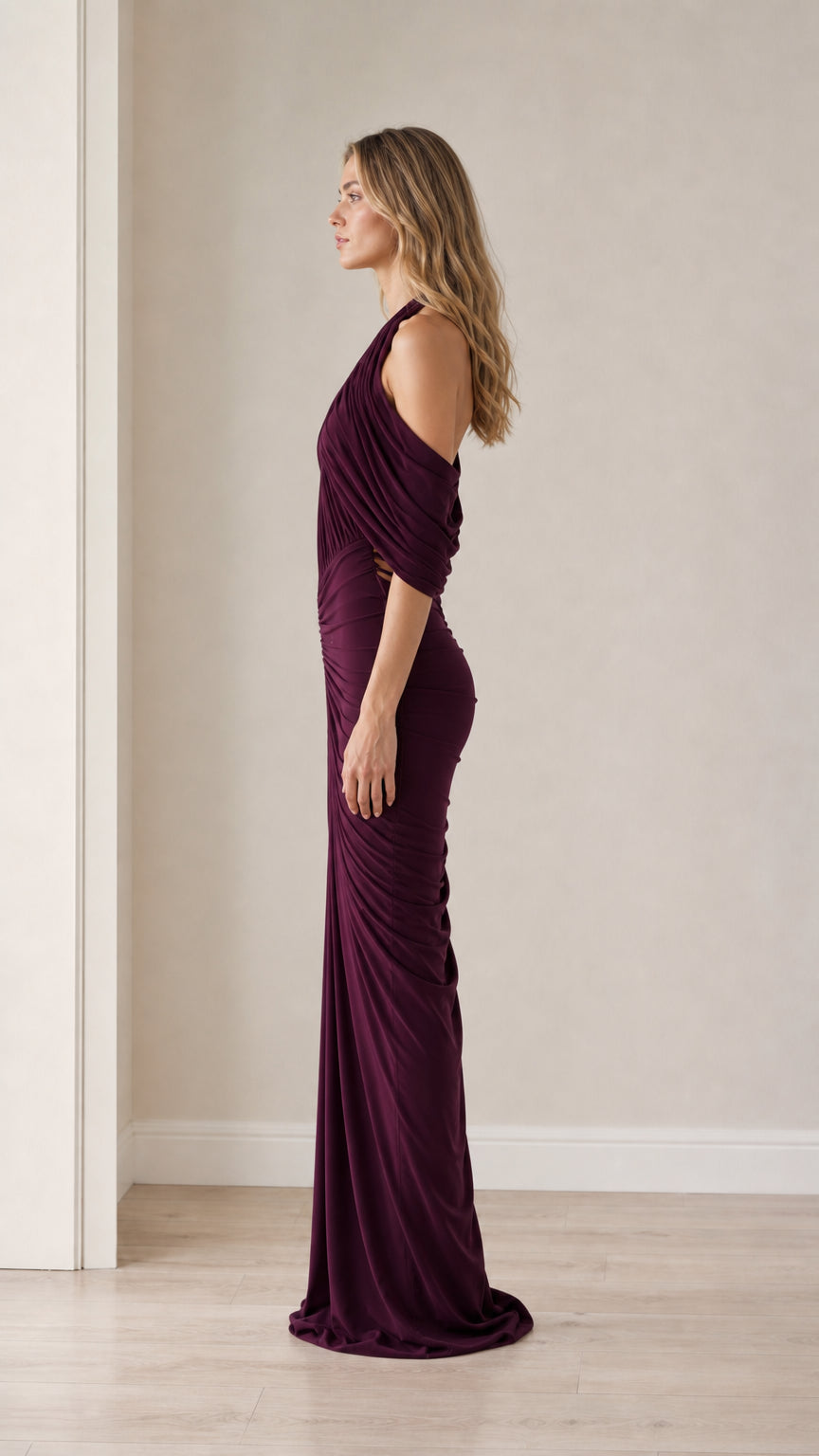Side profile view of the plum evening gown