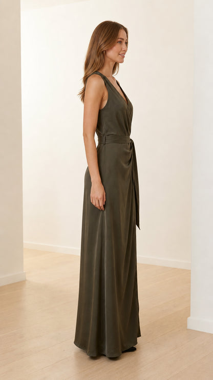 Side profile view of model in olive green satin maxi dress