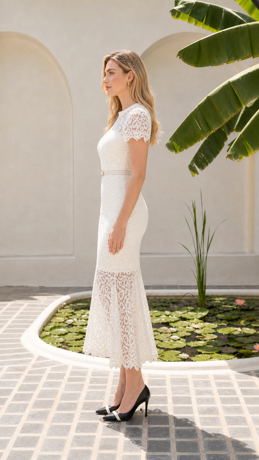 Side profile of model in white floral lace midi dress showing slim mermaid silhouette