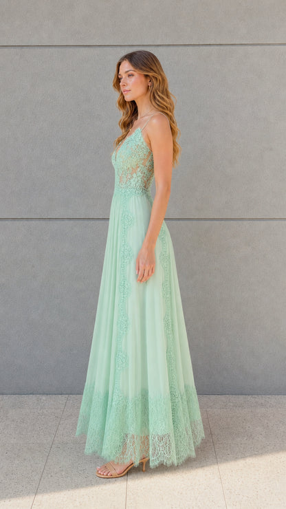 Side angle view of mint green lace bodice pleated maxi dress