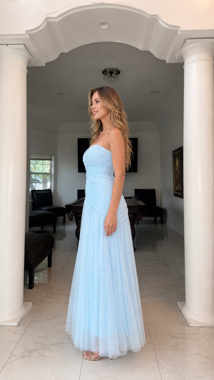 Side view of model in light blue tulle formal gown