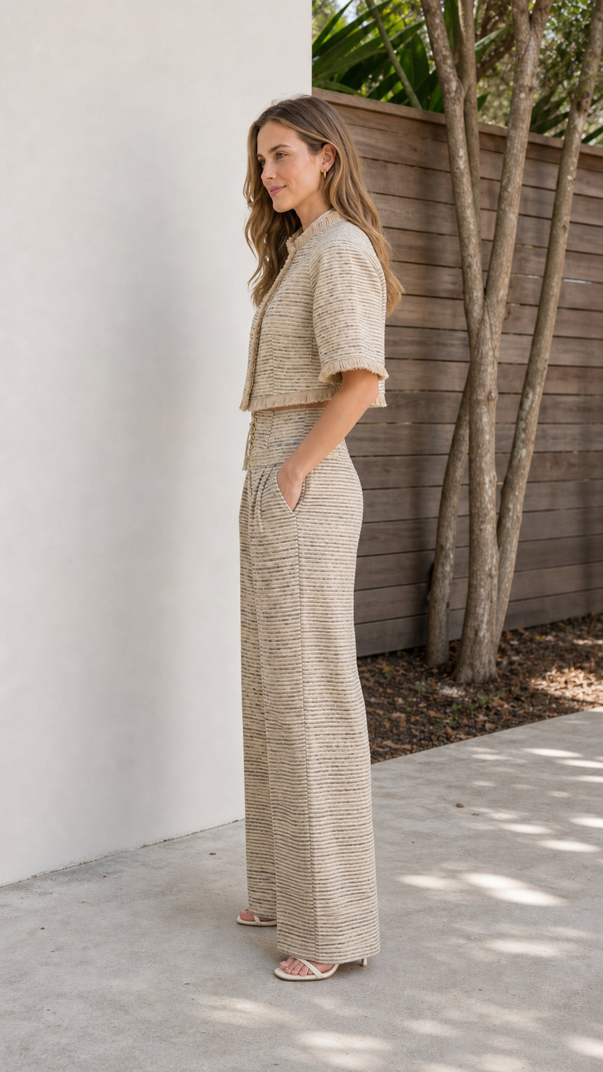 Side profile view of beige tweed set