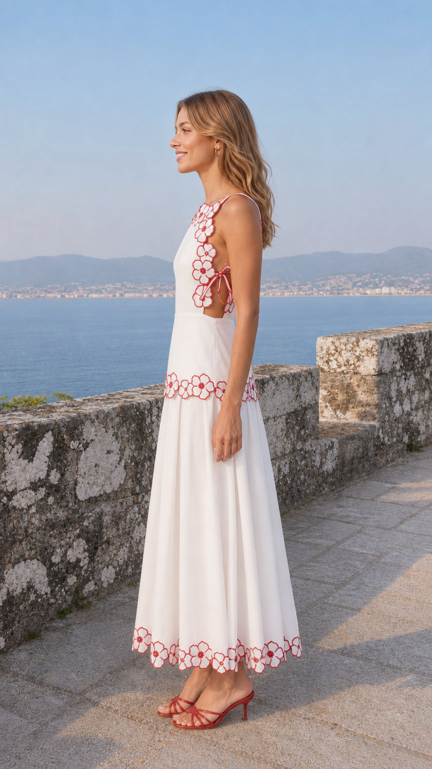 Side profile of woman in white midi dress highlighting side cutout tie