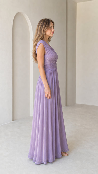 Side profile view of lavender sleeveless pleated floor-length evening gown