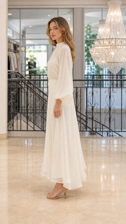 Side profile view of Ivory chiffon maxi dress