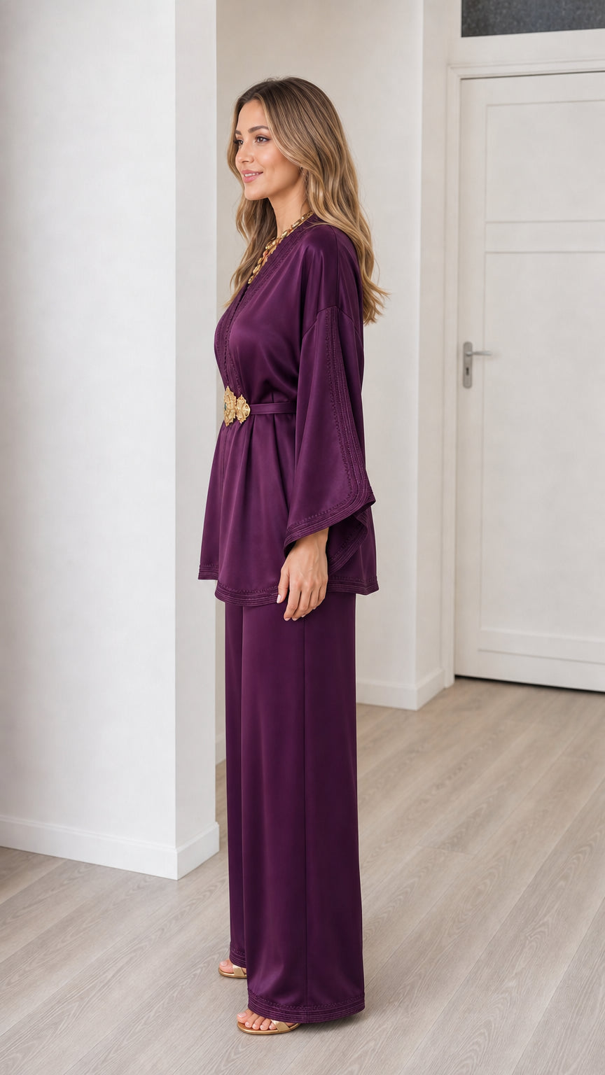 Side profile view of deep purple satin two piece tunic and trousers outfit