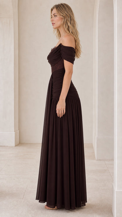 Side profile view of brown evening dress