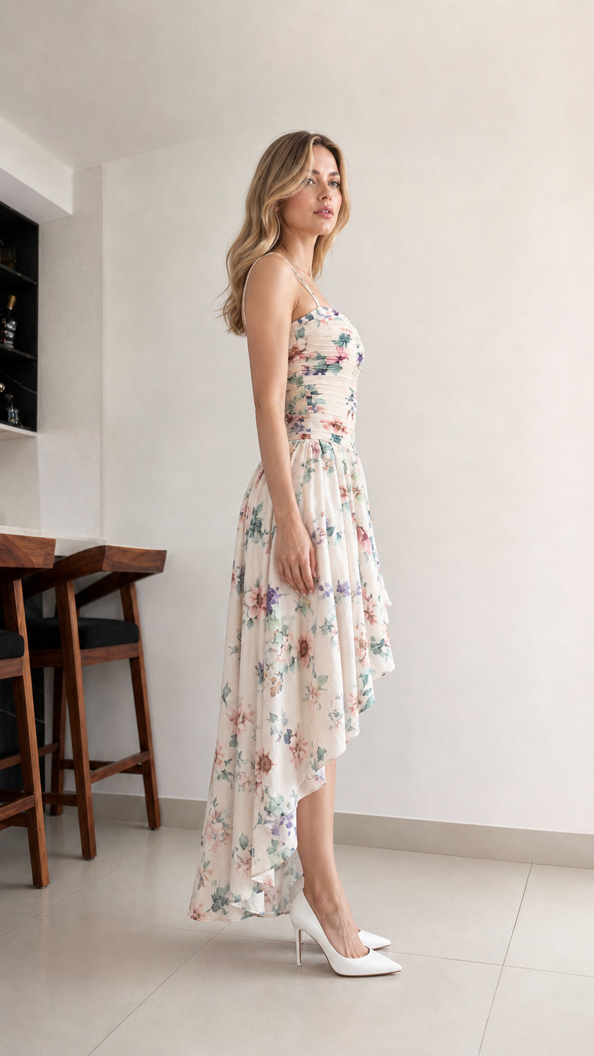 Side profile view of cream floral high-low dress