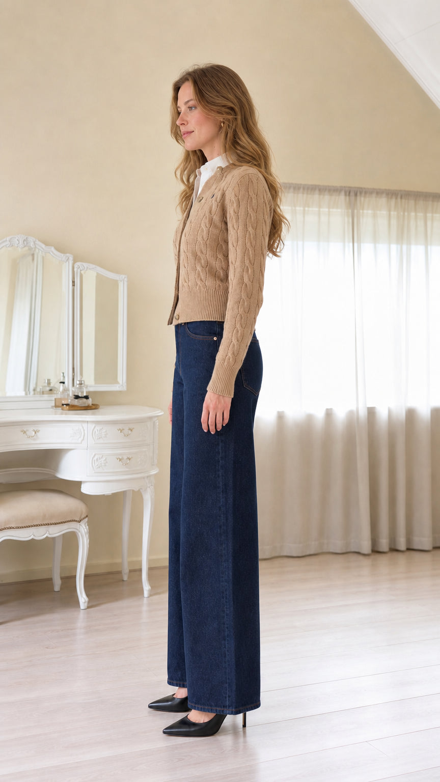 Side profile view of women's camel button-front cable-knit sweater