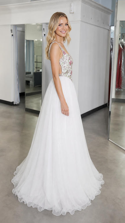 Side profile of white embroidered bodice tulle ball gown