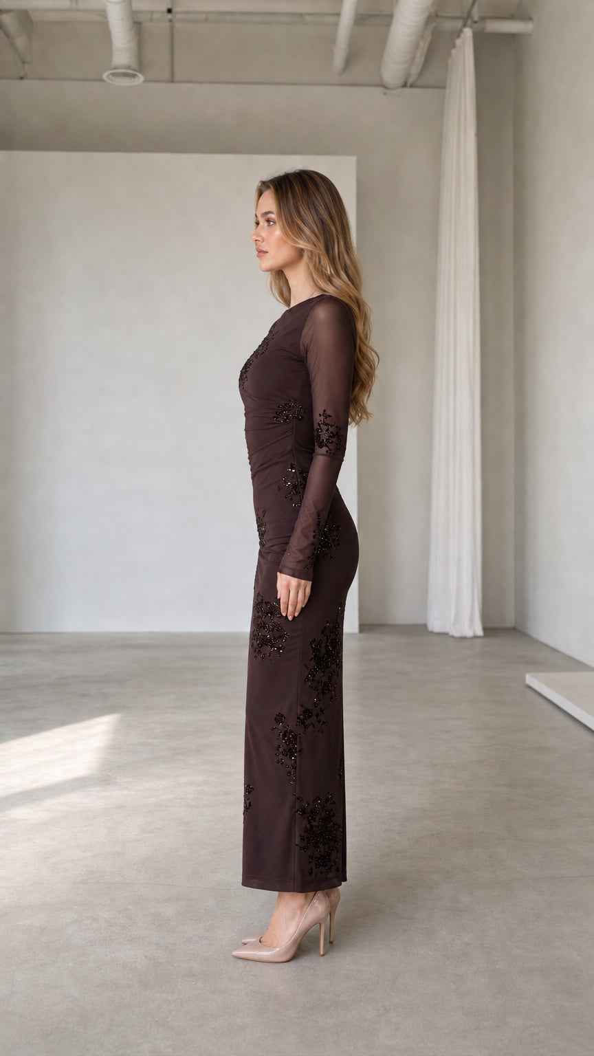 Side profile view of brown evening dress