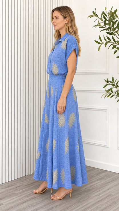 Side profile of model in blue matching set with wide leg pants