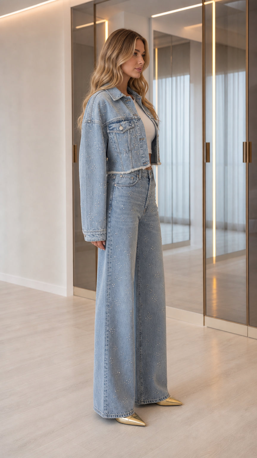 Side angle view of model wearing Light Blue rhinestone two-piece denim set