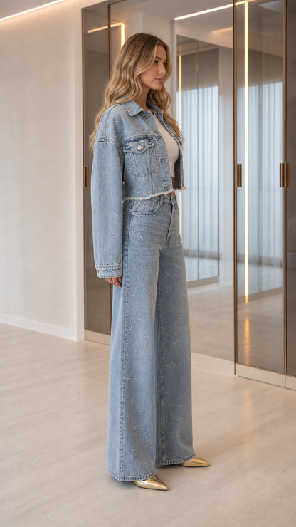 Side angle view of model wearing Light Blue rhinestone two-piece denim set