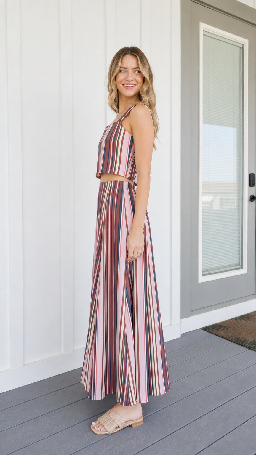 Side view of woman wearing pink striped two-piece set