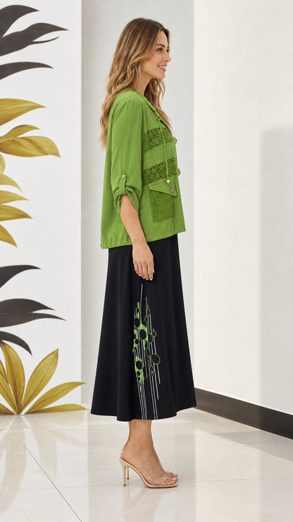 Side angle view of olive green lace-trim jacket paired with printed midi dress