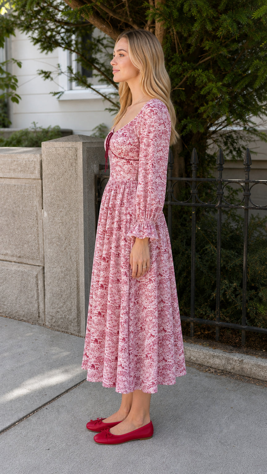 Model wearing red vintage toile print midi dress side view
