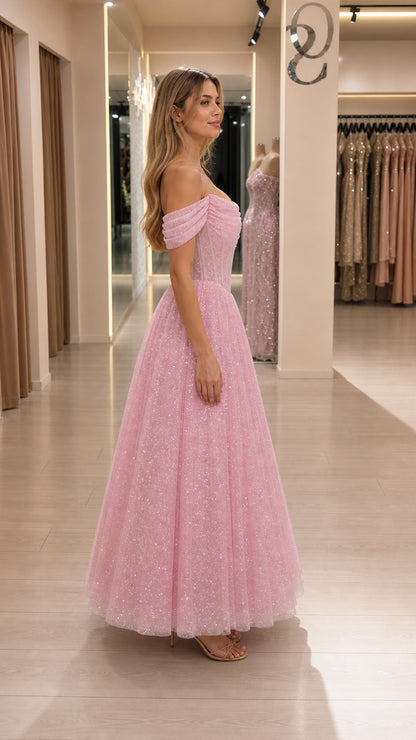 Side profile view of pink glitter tulle dress