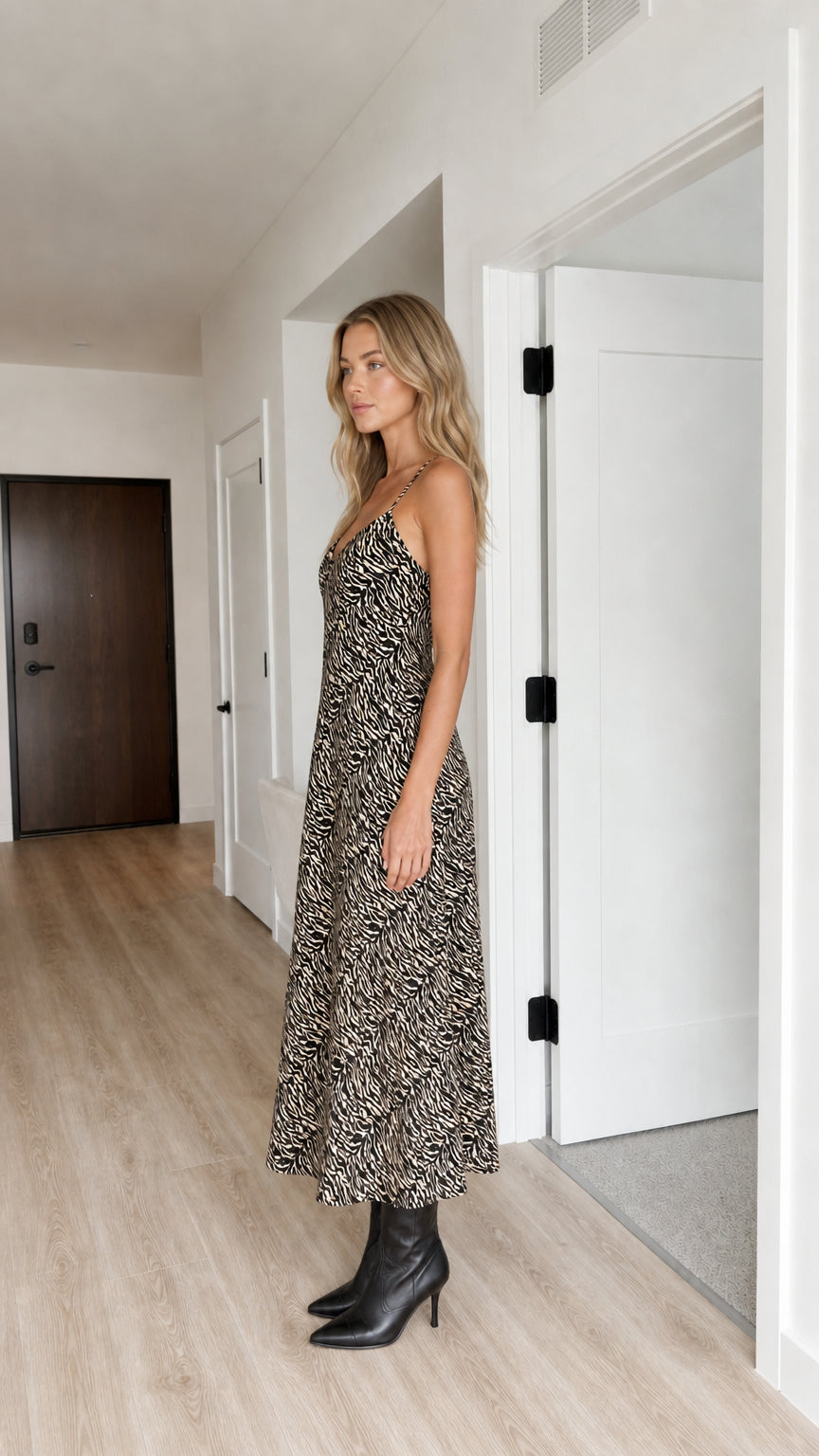 Model wearing Black animal print slip midi dress, side view