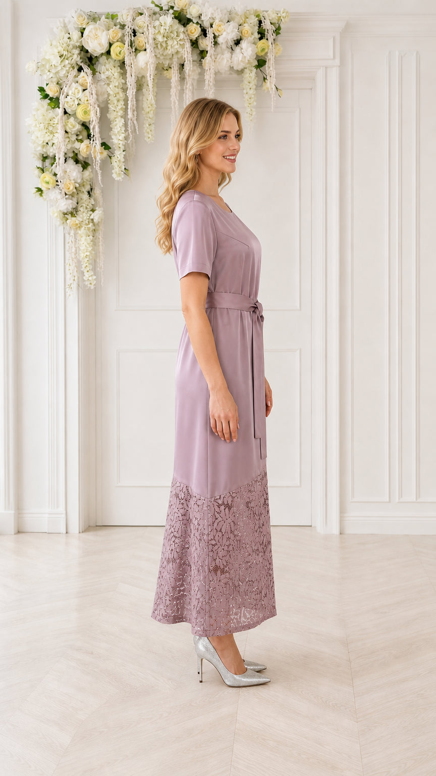 Model wearing mauve lace-trimmed midi dress, side view