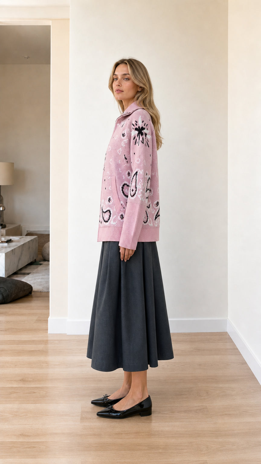 Side profile view of pink paisley pattern zip-up sweater cardigan