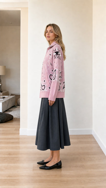 Side profile view of pink paisley pattern zip-up sweater cardigan
