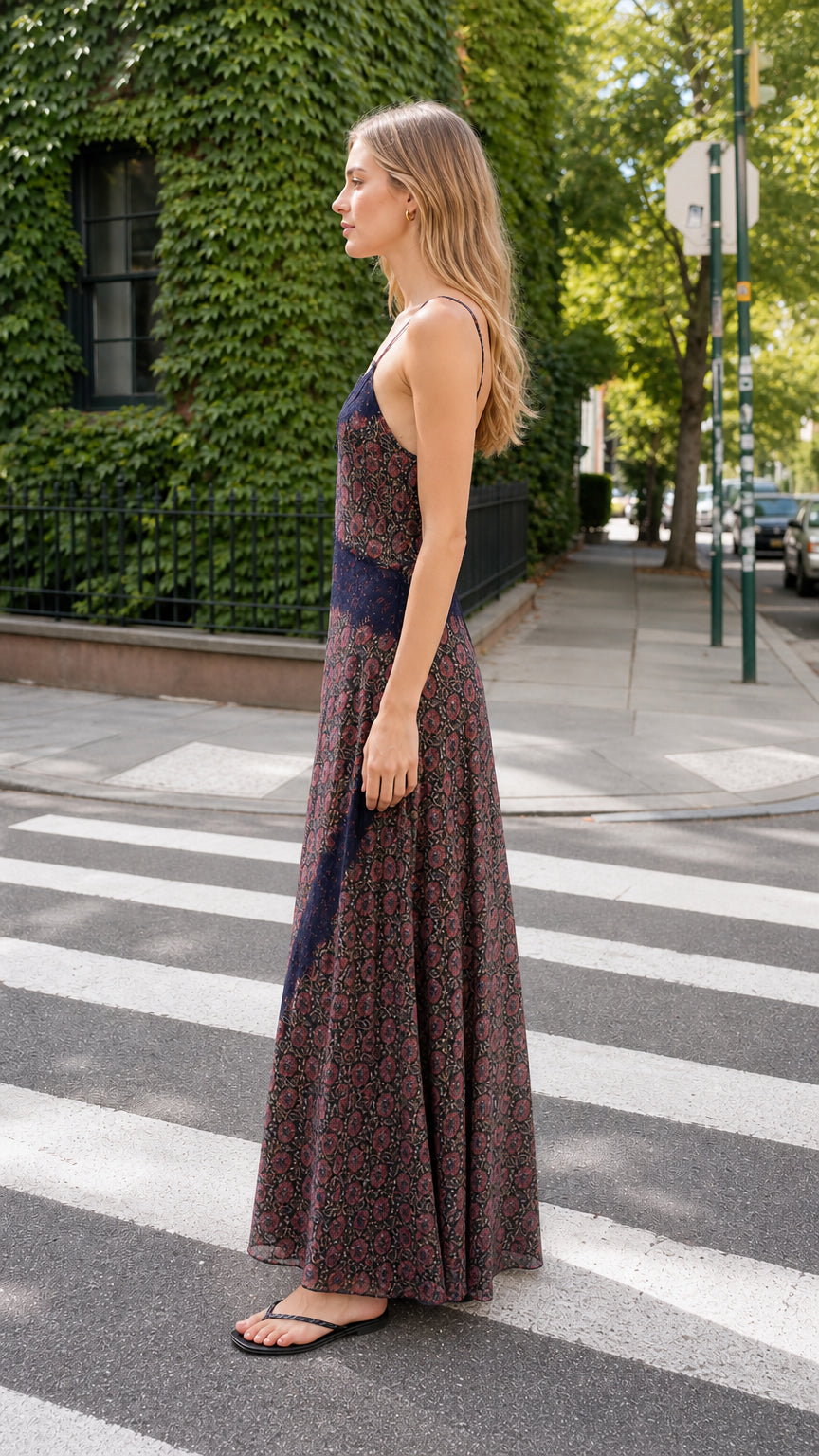 Side profile view of Navy floral maxi slip dress