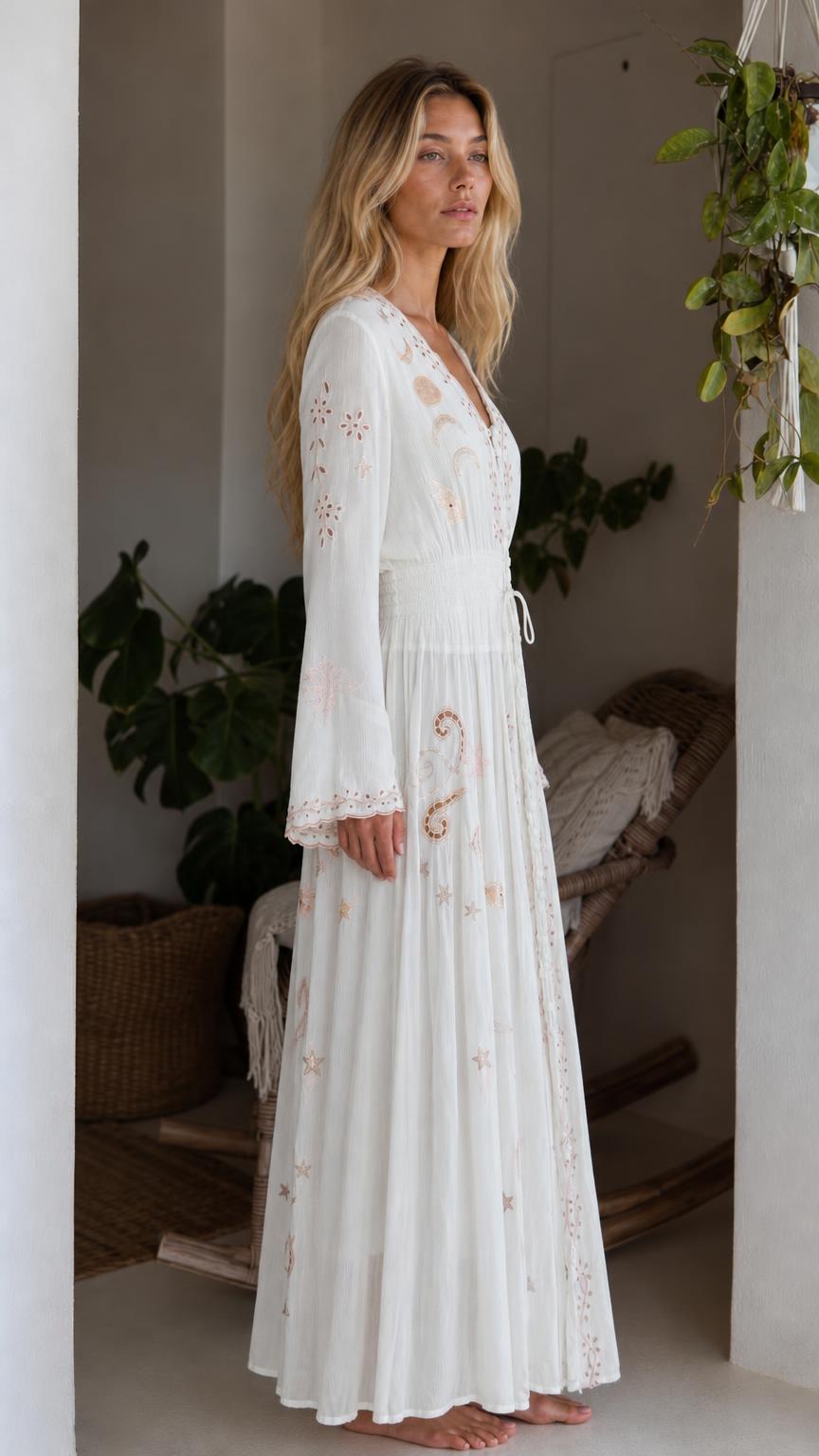 Side profile view of white bohemian celestial maxi dress