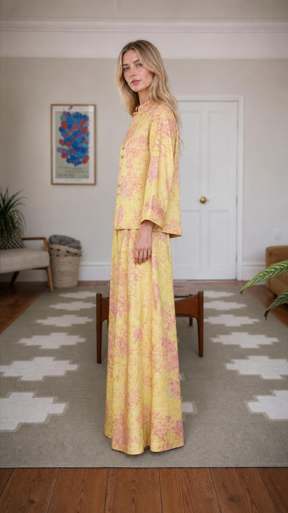 Side profile of woman wearing yellow floral brocade set