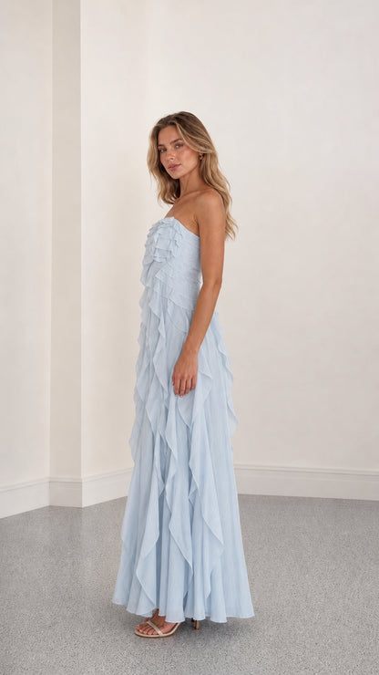Side profile view of light blue ruffle maxi dress