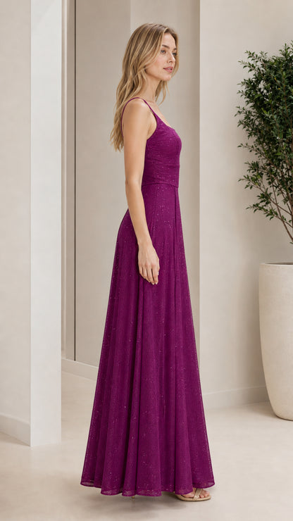 Side profile view of model in purple evening gown