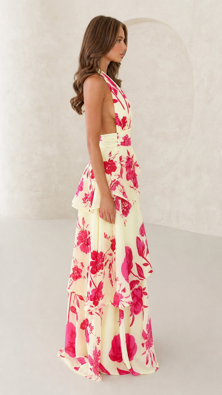 Side view of yellow floral halter neck maxi dress