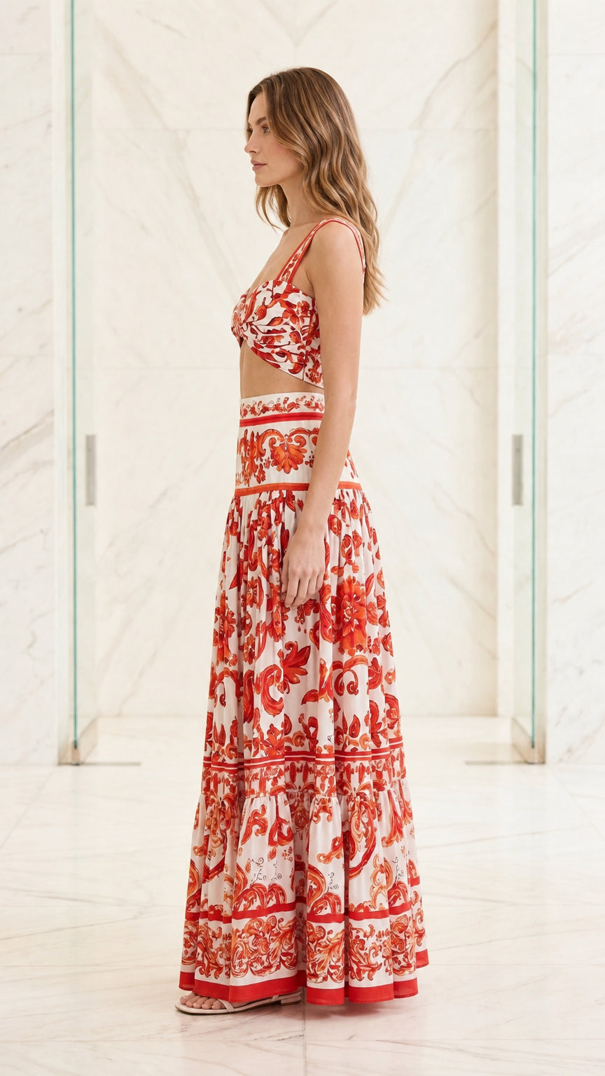 Side profile view of woman wearing red and white two-piece set