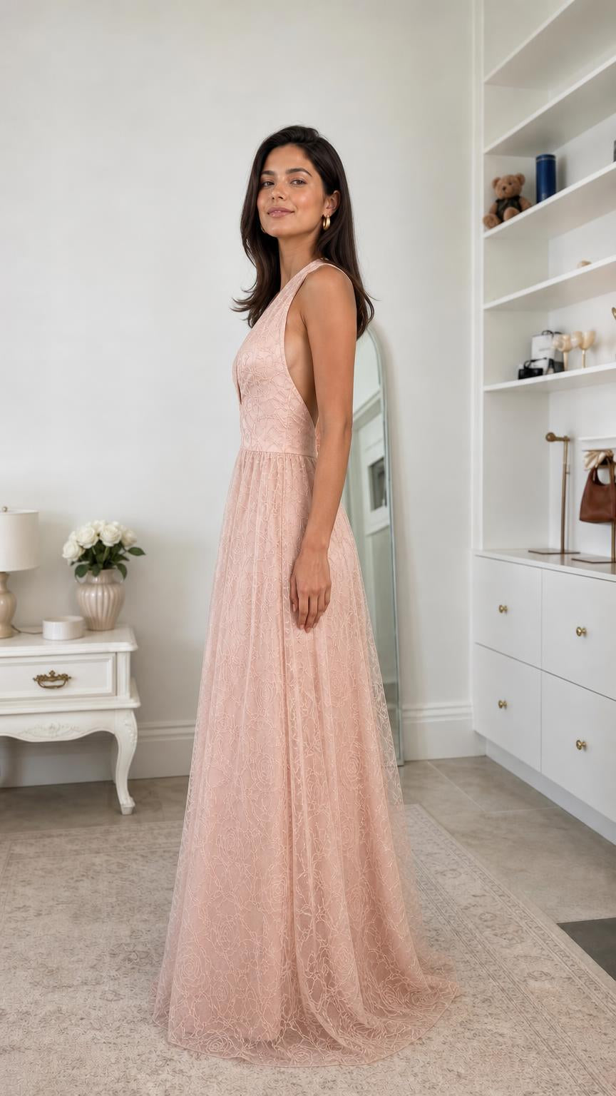 Side profile view of blush pink lace evening dress